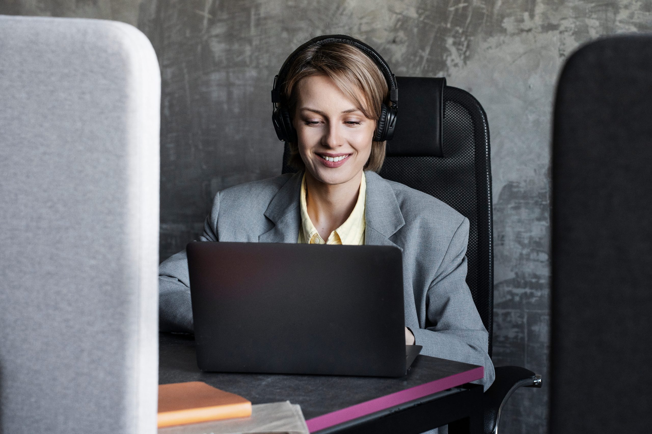 Virtual assistant working remotely with laptop